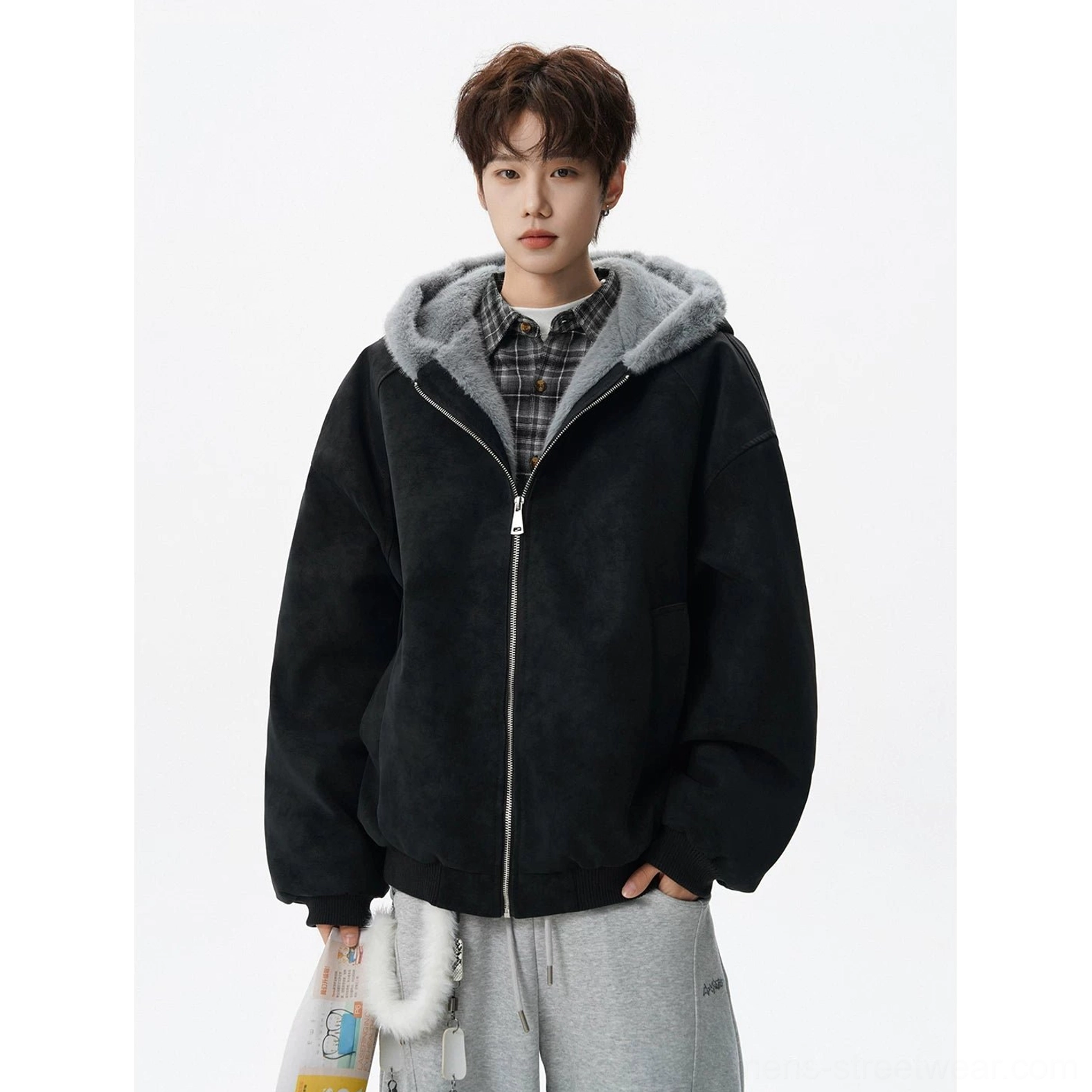Black oversized faux suede hooded bomber jacket with gray plush lining, front pockets, ribbed hem, and relaxed urban outfit