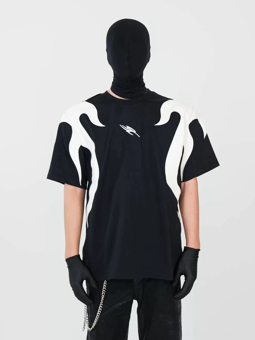 Front view of a black oversized flame panel streetwear T-shirt with symmetrical off-white side flames, small chest emblem, and Y2K cyberpunk styling