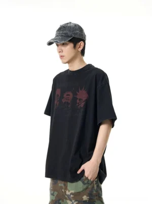 Side view of a relaxed oversized black graphic T-shirt showing the drop shoulder silhouette and loose short sleeves