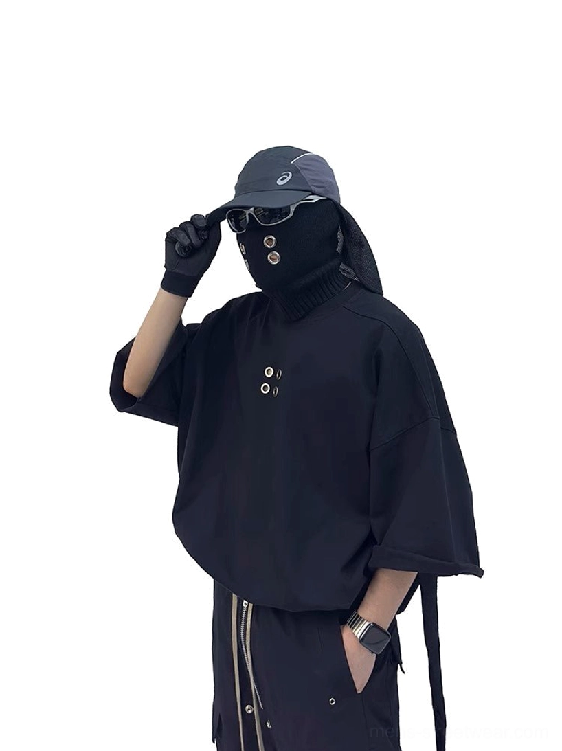 Black oversized streetwear tee with raw-style wide sleeve edge, front grommets and hanging side utility strap