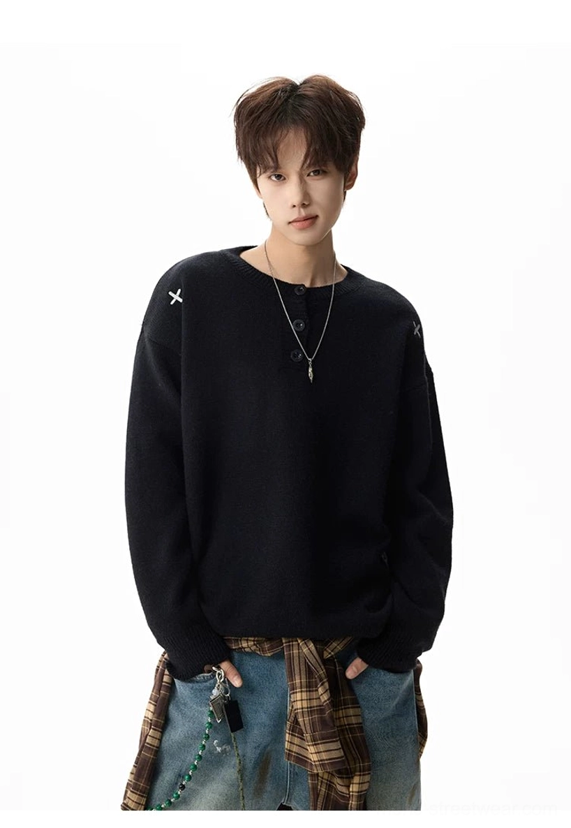 Black oversized henley sweater styled with a plaid waist layer and delicate silver necklace for Korean streetwear fashion