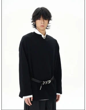 Black oversized long-sleeve Korean streetwear shirt styled with a layered white collared shirt wide-leg trousers and leather belt