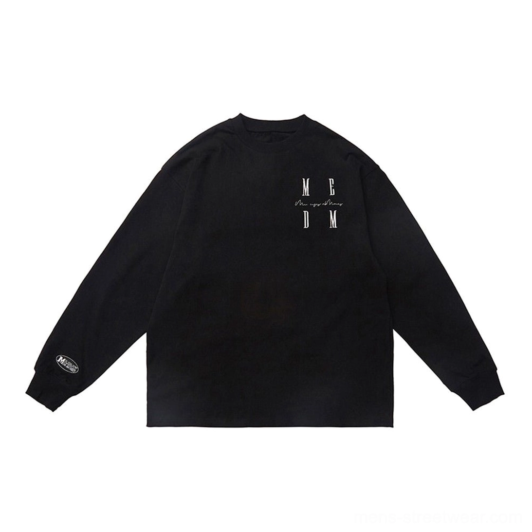 Black oversized cotton long sleeve T-shirt flat lay featuring chest MCDM graphic and classic crew neck design