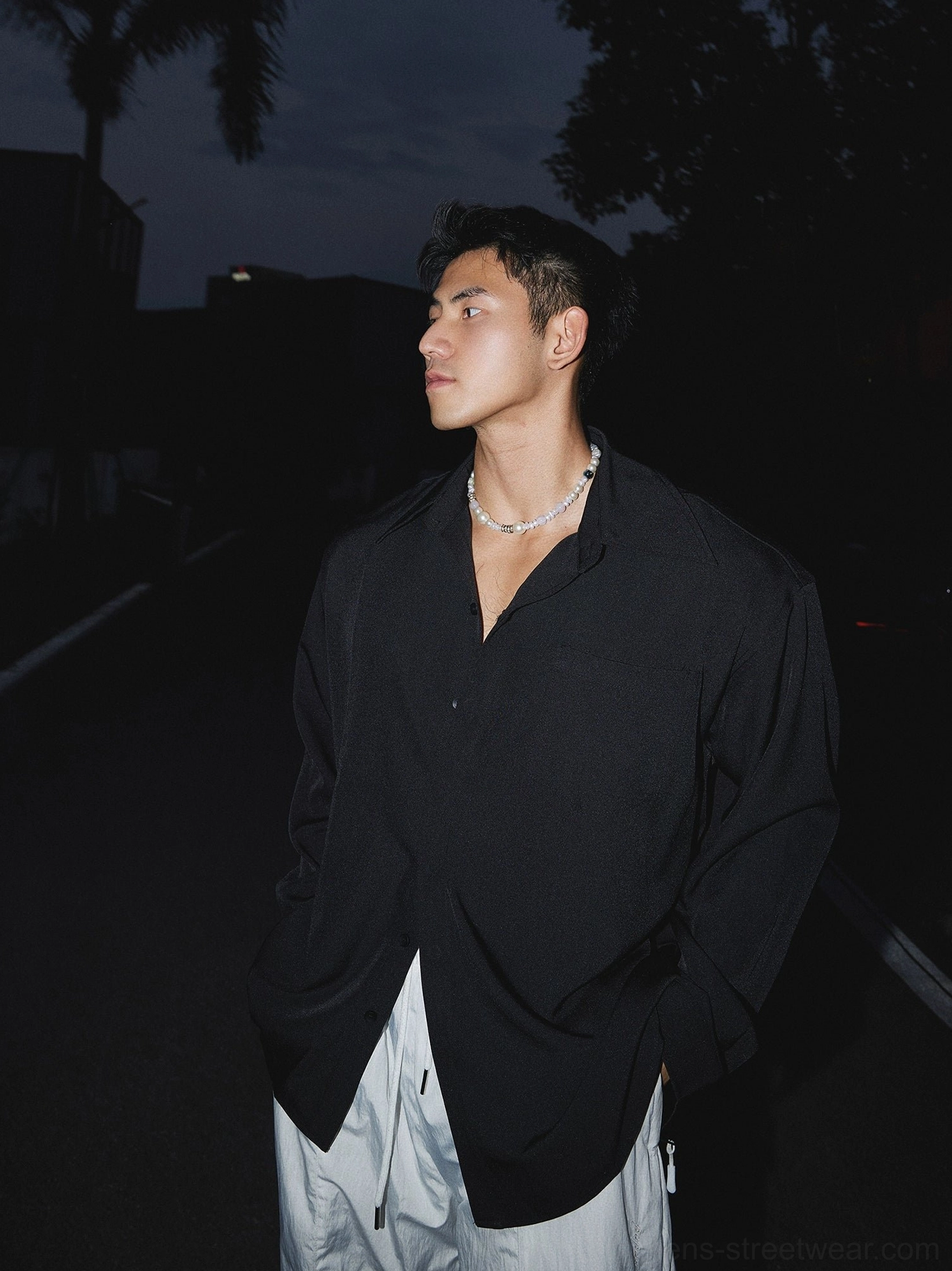 Black oversized men's streetwear dress shirt with relaxed silhouette and modern Seoul-inspired styling