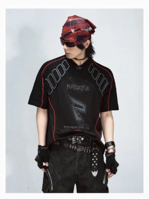 Black oversized mesh graphic jersey T-shirt with red contrast piping, grey logo print, structured shoulders, and punk streetwear styling