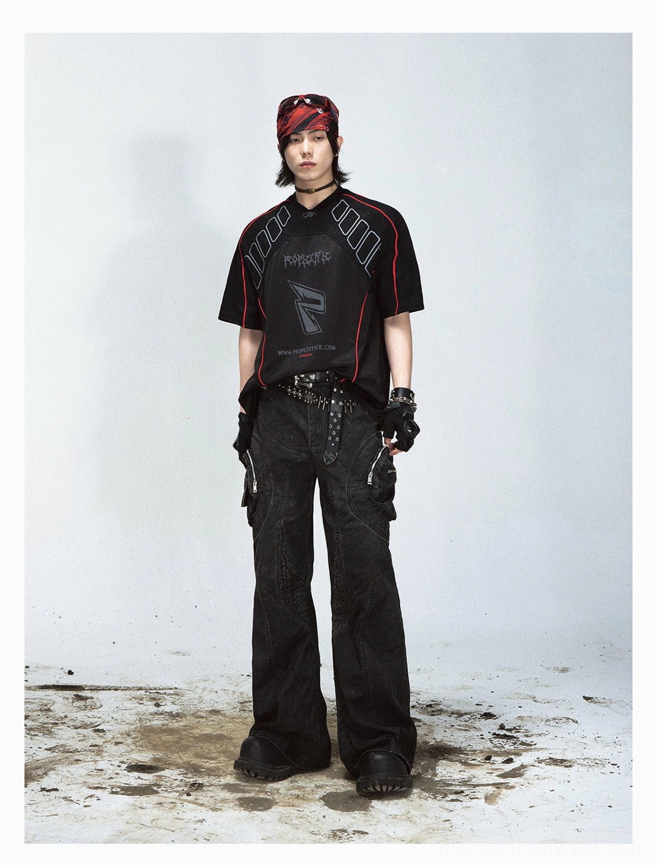 Black oversized mesh graphic sport T-shirt with red piping, grey graffiti branding, leather belt styling, and punk streetwear details