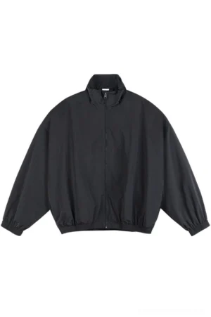Black oversized mesh-lined stand collar windbreaker jacket front view with full zip closure and elasticated hem