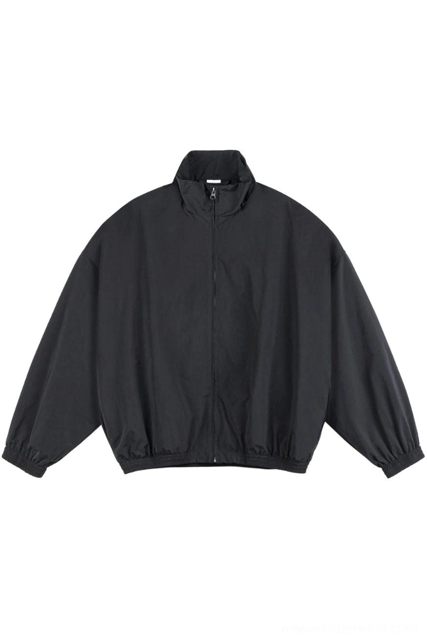 Black oversized mesh-lined stand collar windbreaker jacket front view with full zip closure and elasticated hem