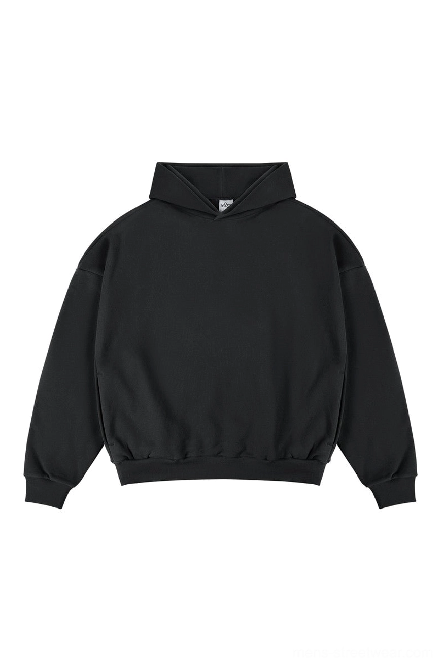 Black oversized minimalist streetwear hoodie with drop shoulders and ribbed waistband