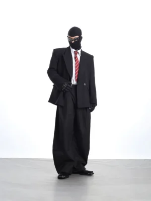 Full body view of black oversized pinstripe suit styling with relaxed blazer, wide leg trousers, red tie, and futuristic Seoul streetwear attitude