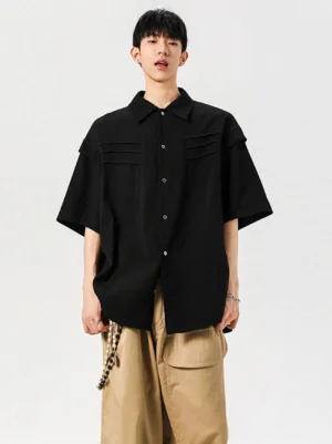 Black oversized pleated chest panel button shirt styled with khaki wide-leg trousers for a modern Korean streetwear outfit