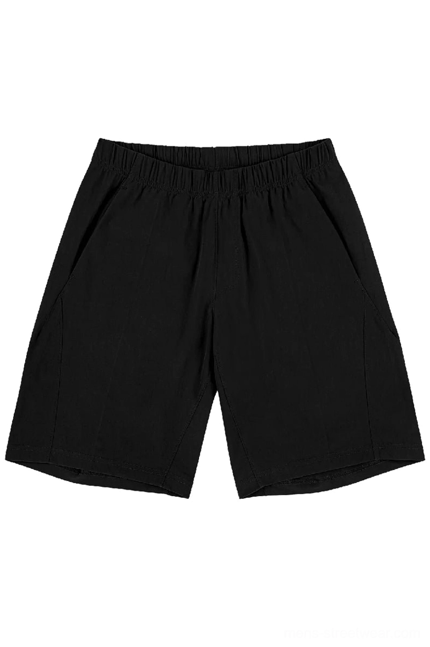 Black oversized quick-dry tech shorts front flat lay with clean matte finish and hidden side pockets