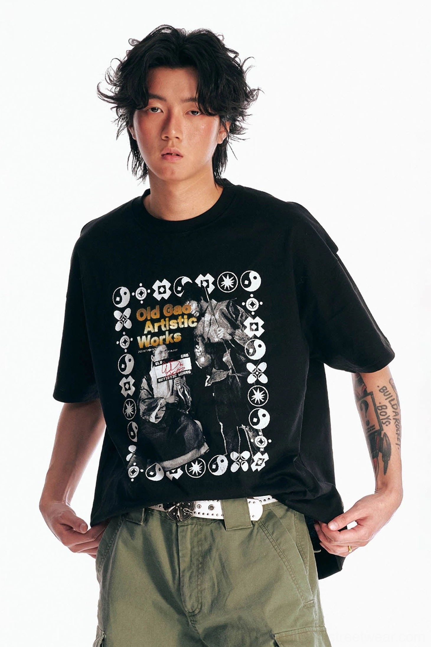 Black oversized retro cinema graphic cotton T-shirt close-up showing the detailed vintage movie poster print and fabric texture