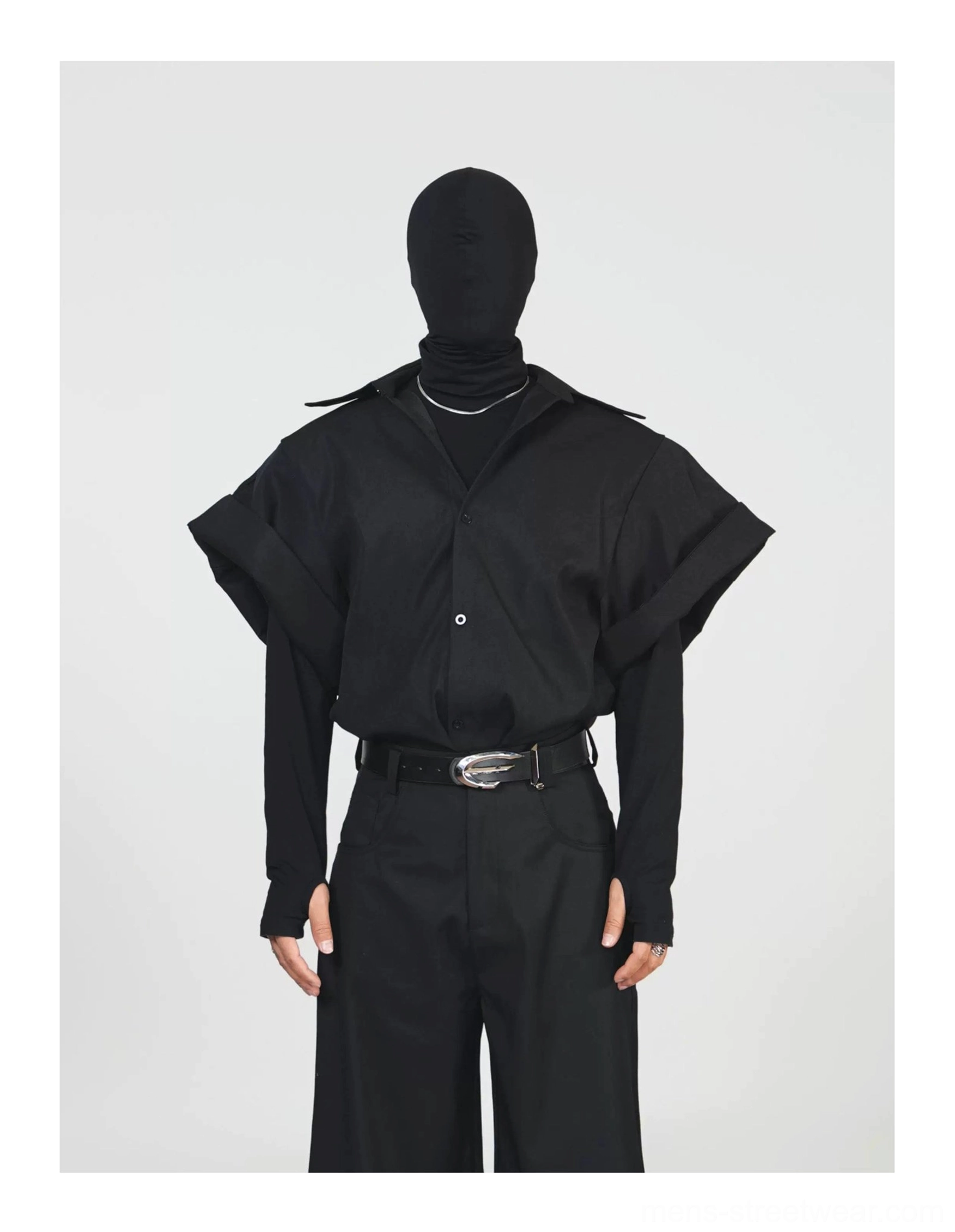 Full front view of a black oversized short sleeve button down shirt jacket with classic collar and rolled sleeves