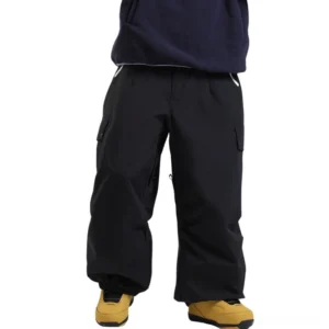 Black oversized ski cargo pants with waterproof outdoor shell, multiple utility pockets, relaxed wide-leg silhouette, high waist, and yellow-brown snow boots