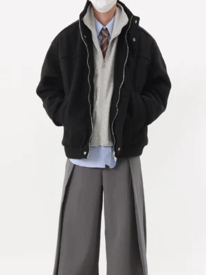 Black oversized stand collar layered bomber jacket front full body view with zippered pockets and relaxed streetwear silhouette