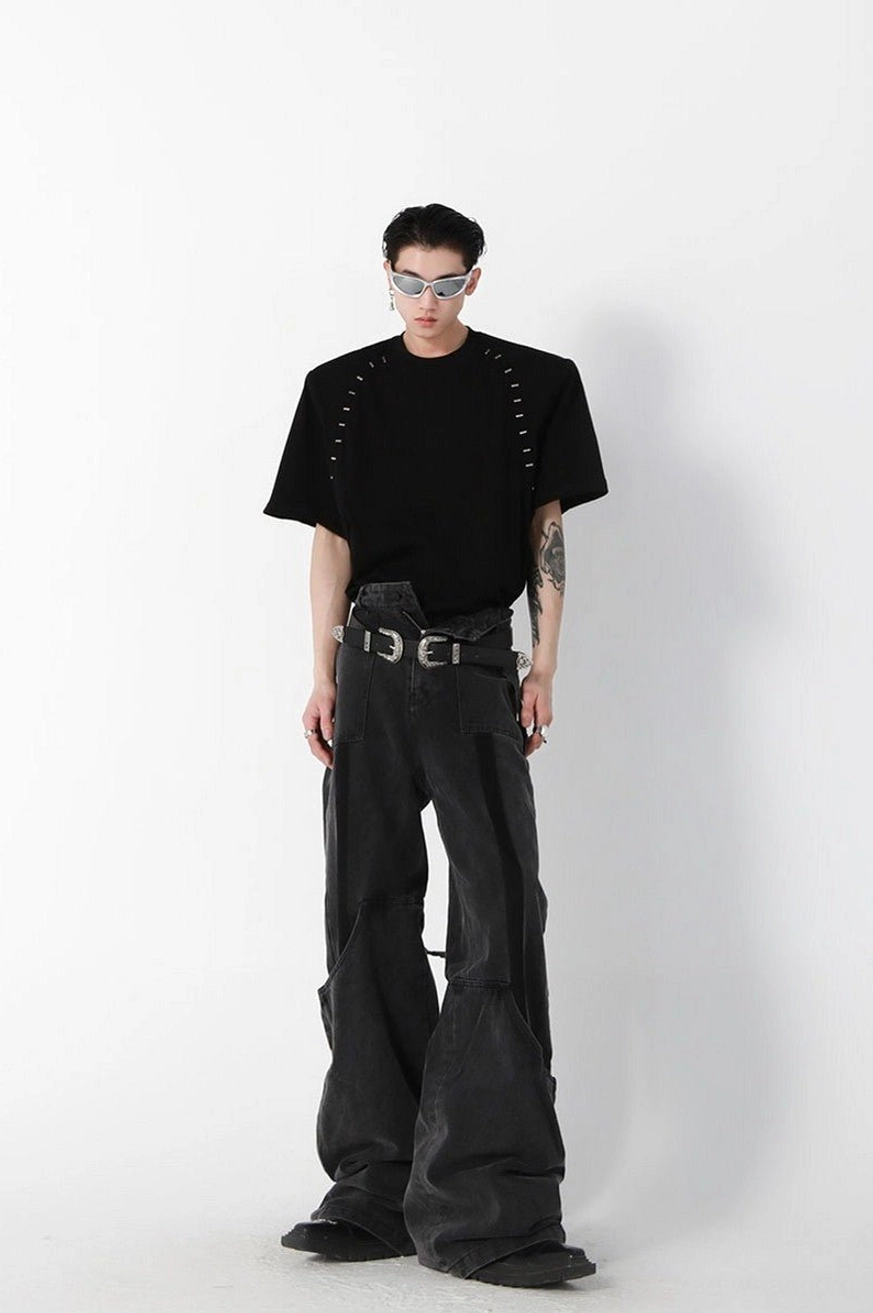 Black oversized structured stitch cotton tee with padded shoulders, crew neckline, short sleeves, and monochrome avant-garde streetwear styling