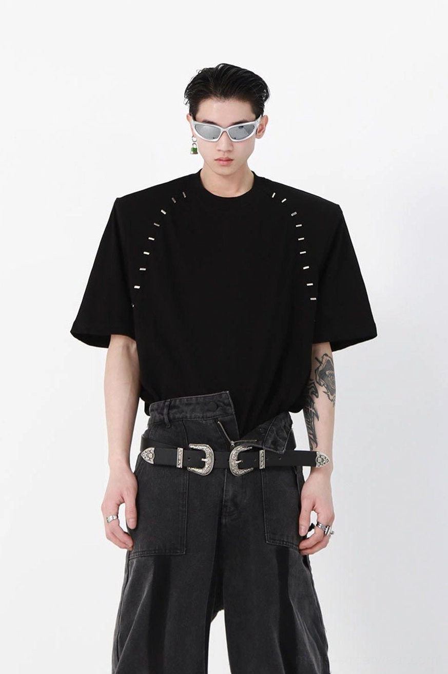 Black oversized structured stitch T-shirt with padded shoulders, industrial decorative shoulder stitching, loose crew neck, and avant-garde Seoul streetwear look