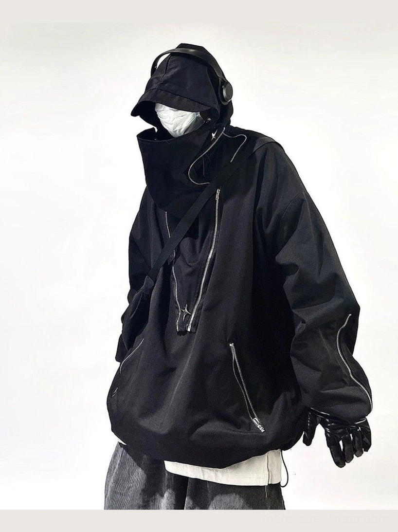 Black oversized tactical hooded jacket shown from the front three-quarter view with high neck, multiple silver zippers, and adjustable hem