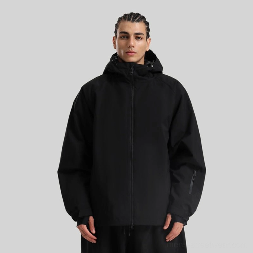 Black oversized outdoor shell jacket in full front view, featuring a clean techwear silhouette and glove-friendly thumb-loop cuffs