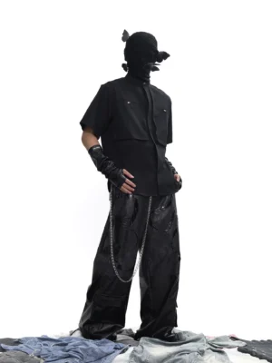 Black oversized utility tech shirt front full body view featuring concealed placket and twin flap chest pockets