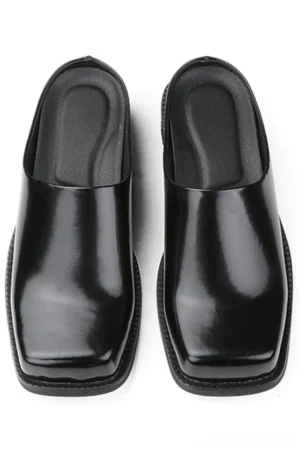 Black patent square-toe slip-on mules displayed from a top-down view on a clean white studio background, showing the glossy cowhide upper, open-back design, and minimalist Korean streetwear silhouette