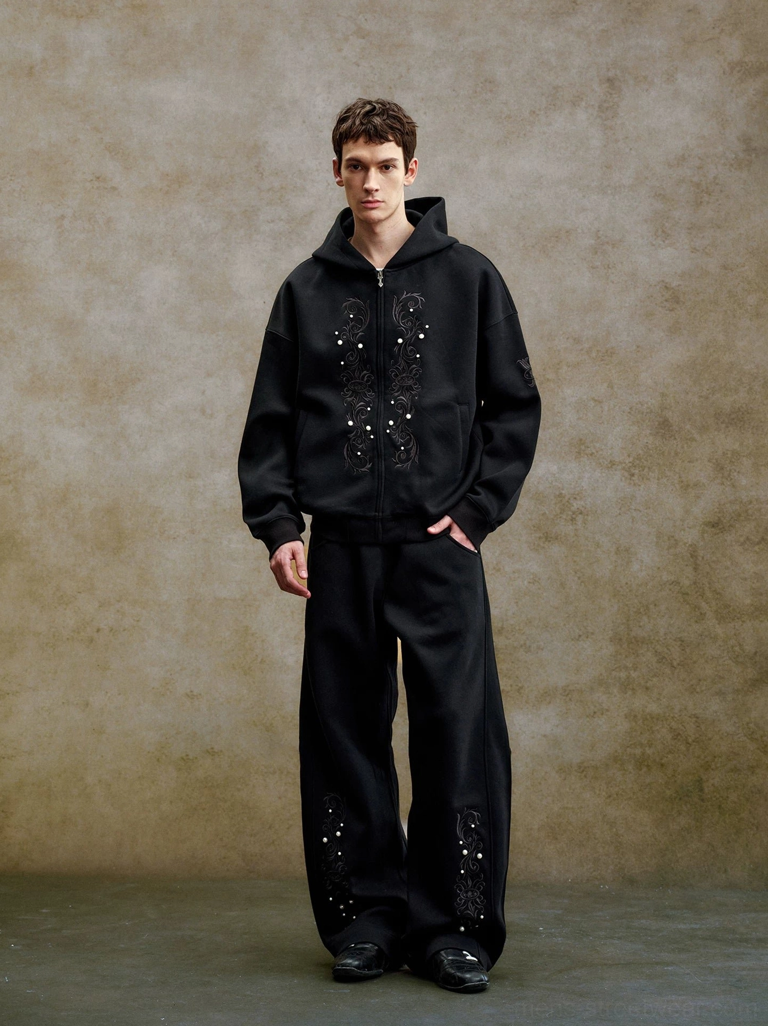 Black pearl embroidered zip-up hoodie styled with matching embroidered trousers in an oversized Korean streetwear outfit