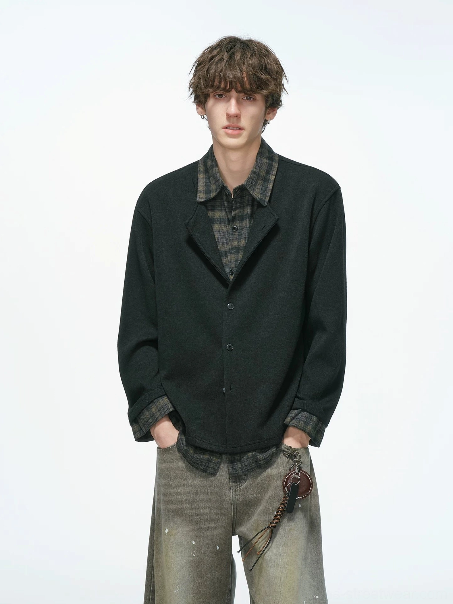 Black layered knit shirt jacket with exposed brown plaid inner shirt shown in a full front streetwear outfit