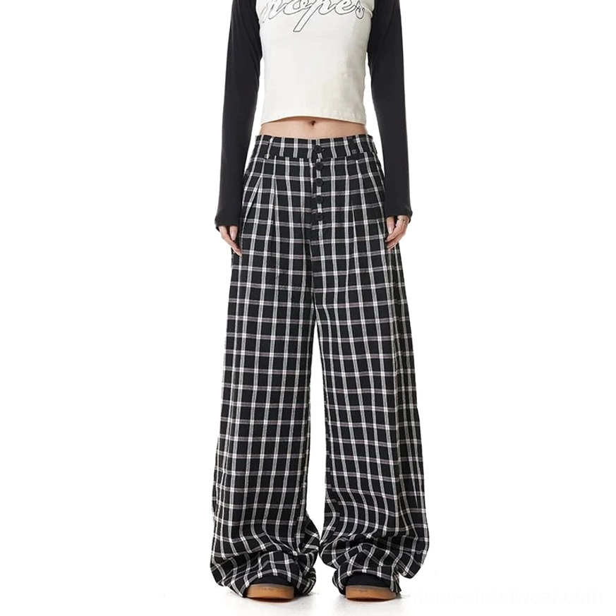 Black and white plaid high-waisted wide-leg pants with relaxed oversized tailoring and button-front detail styled for Korean streetwear