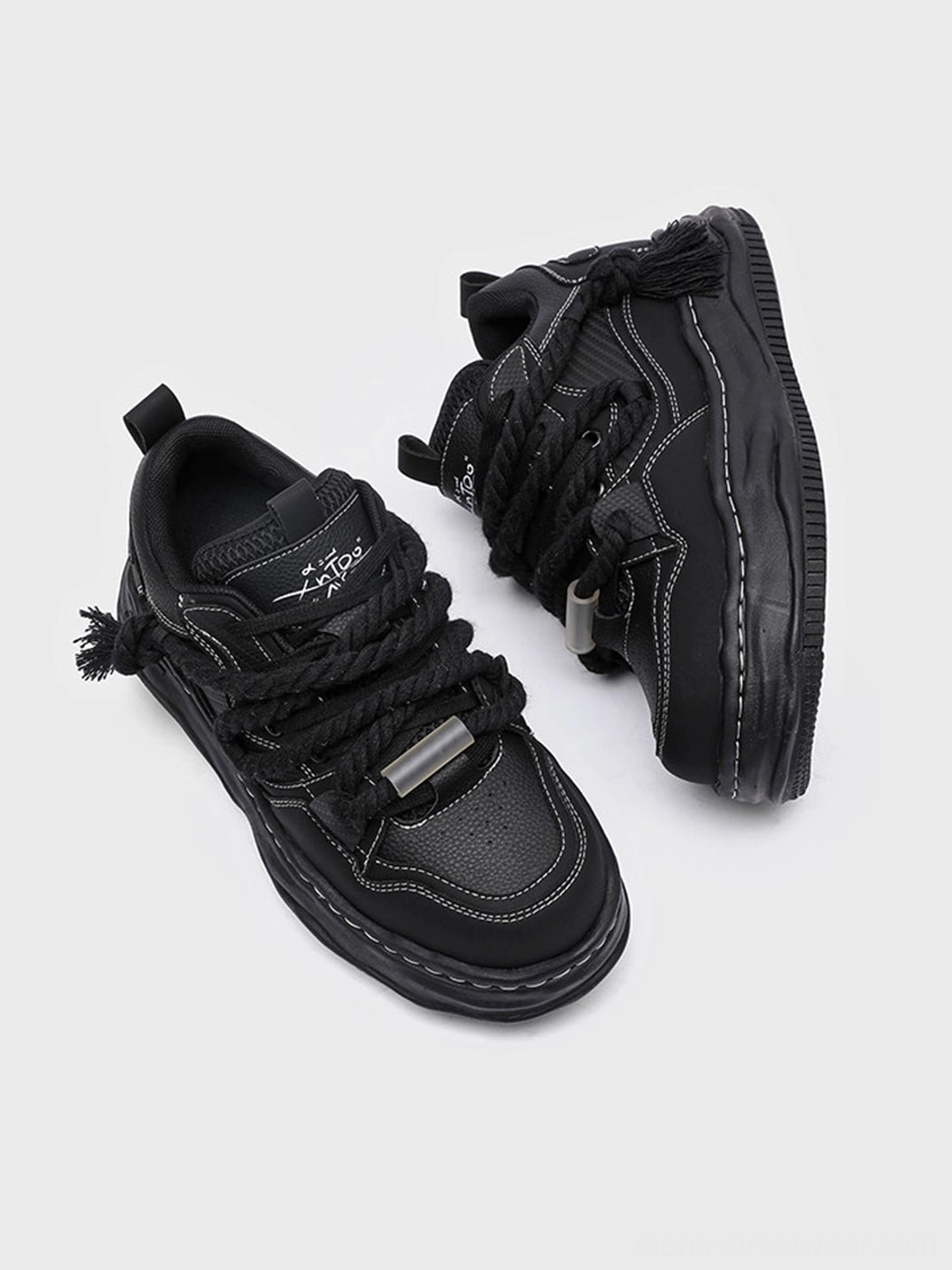 Black platform sneakers with wave-shaped outsole and utility-inspired rope laces for unisex Korean fashion and contemporary streetwear