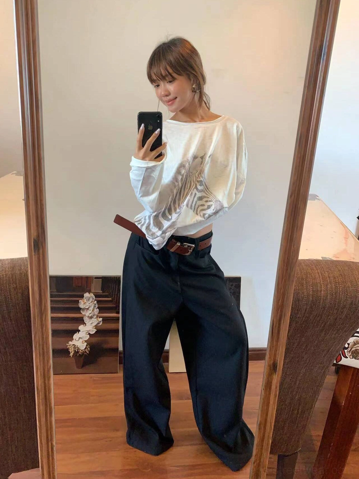 Black pleated wide-leg trousers styled with a cropped long-sleeve top for a relaxed Acubi-inspired Korean fashion outfit