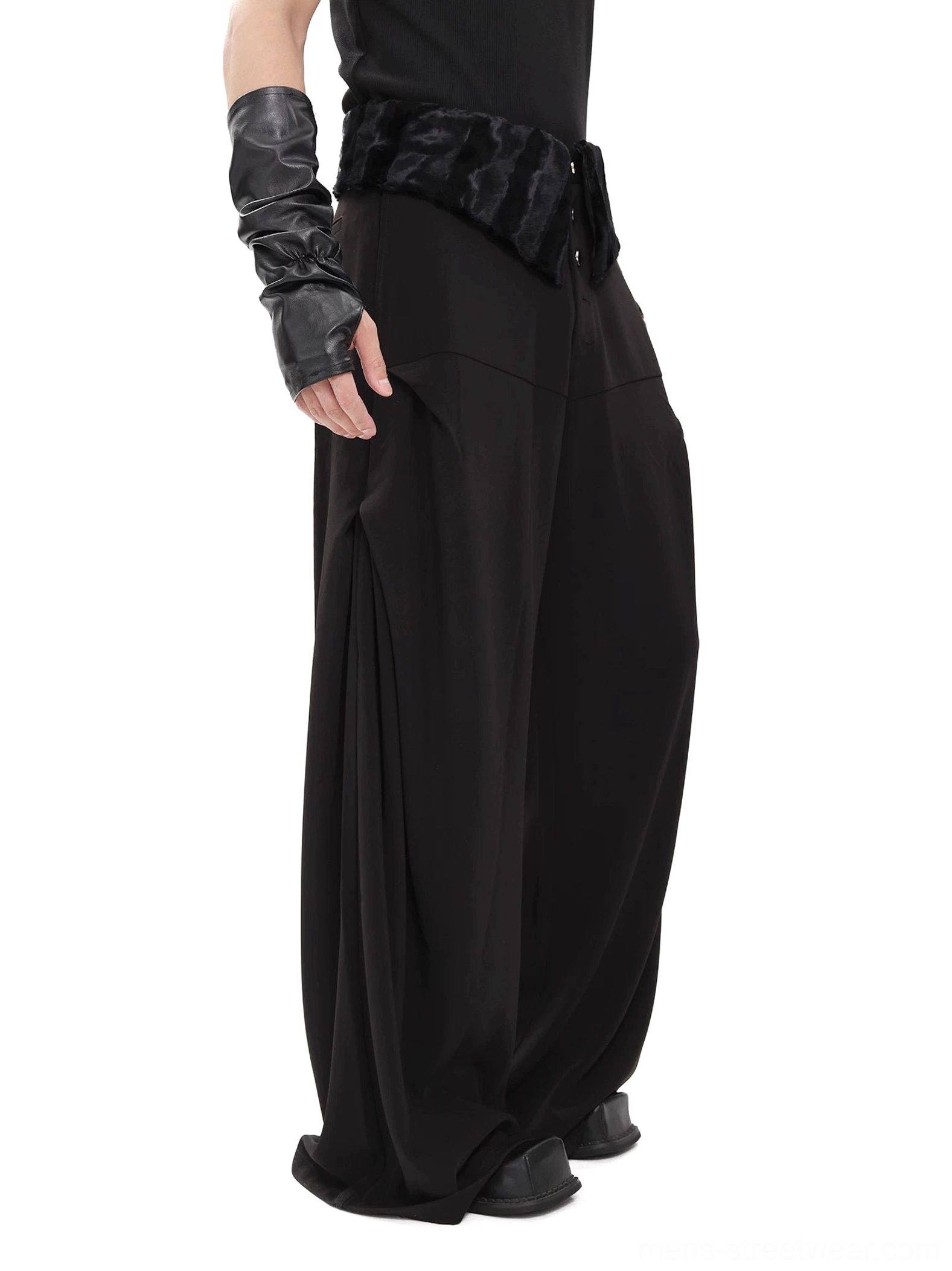 Black plush yoke wide-leg streetwear trousers shown in left side view with oversized side pocket and cropped black top