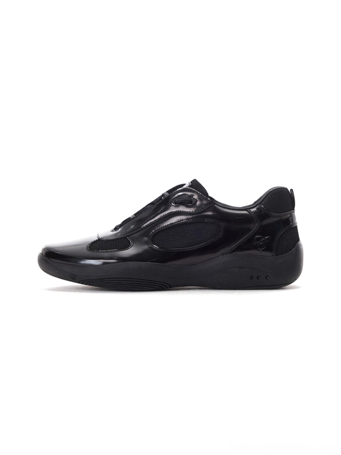 Black polished leather retro runner sneakers shown in a left side profile with glossy cowhide upper mesh panels and sculpted streetwear outsole