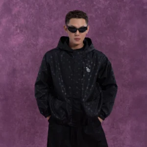 Black polka dot oversized hooded streetwear windbreaker jacket front full body view with relaxed fit