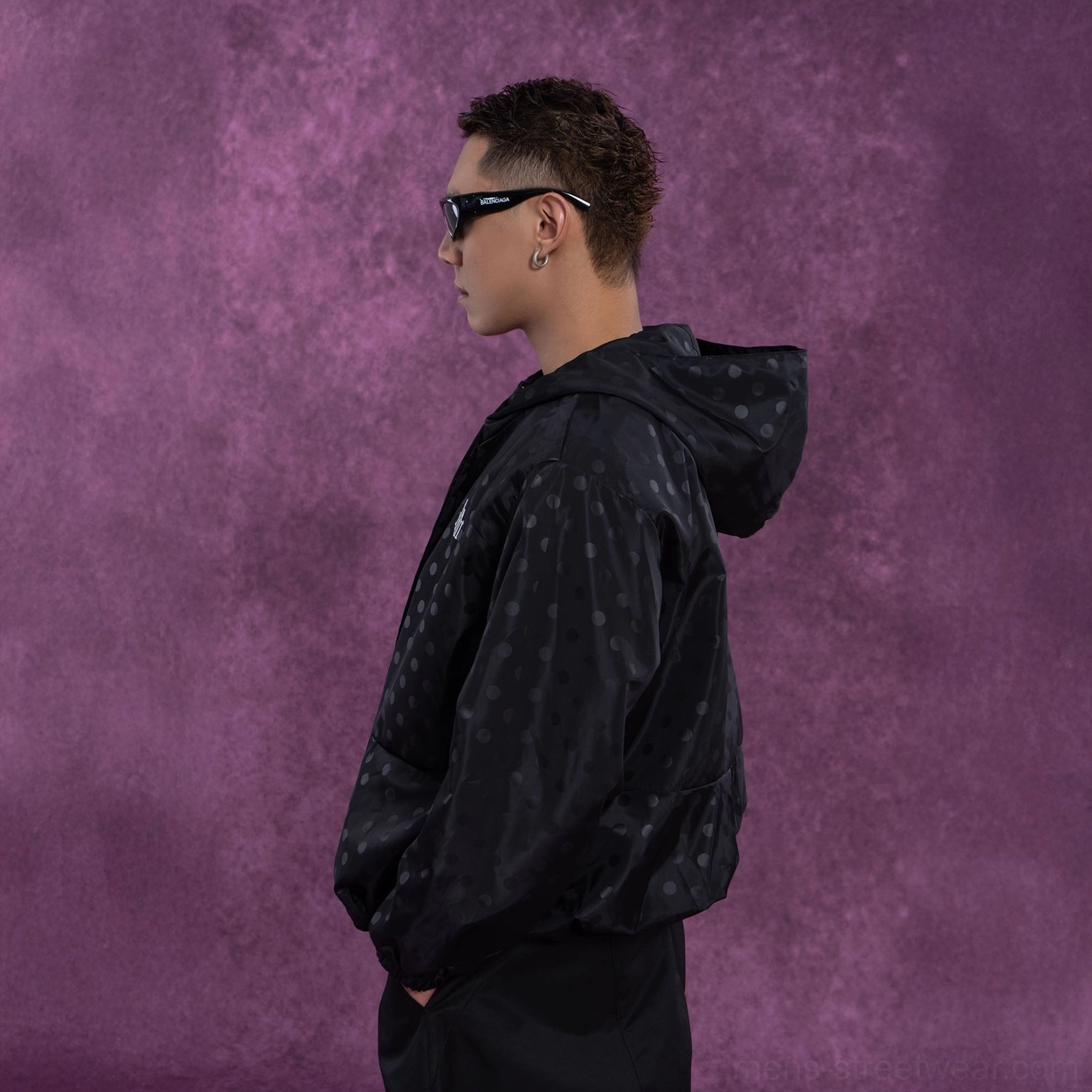 Black oversized polka dot streetwear windbreaker jacket right side view with hood and front pocket