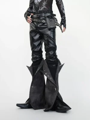 Three-quarter front view of black PU cyberpunk gaiter pants with flared lower leg panels and industrial punk accessories