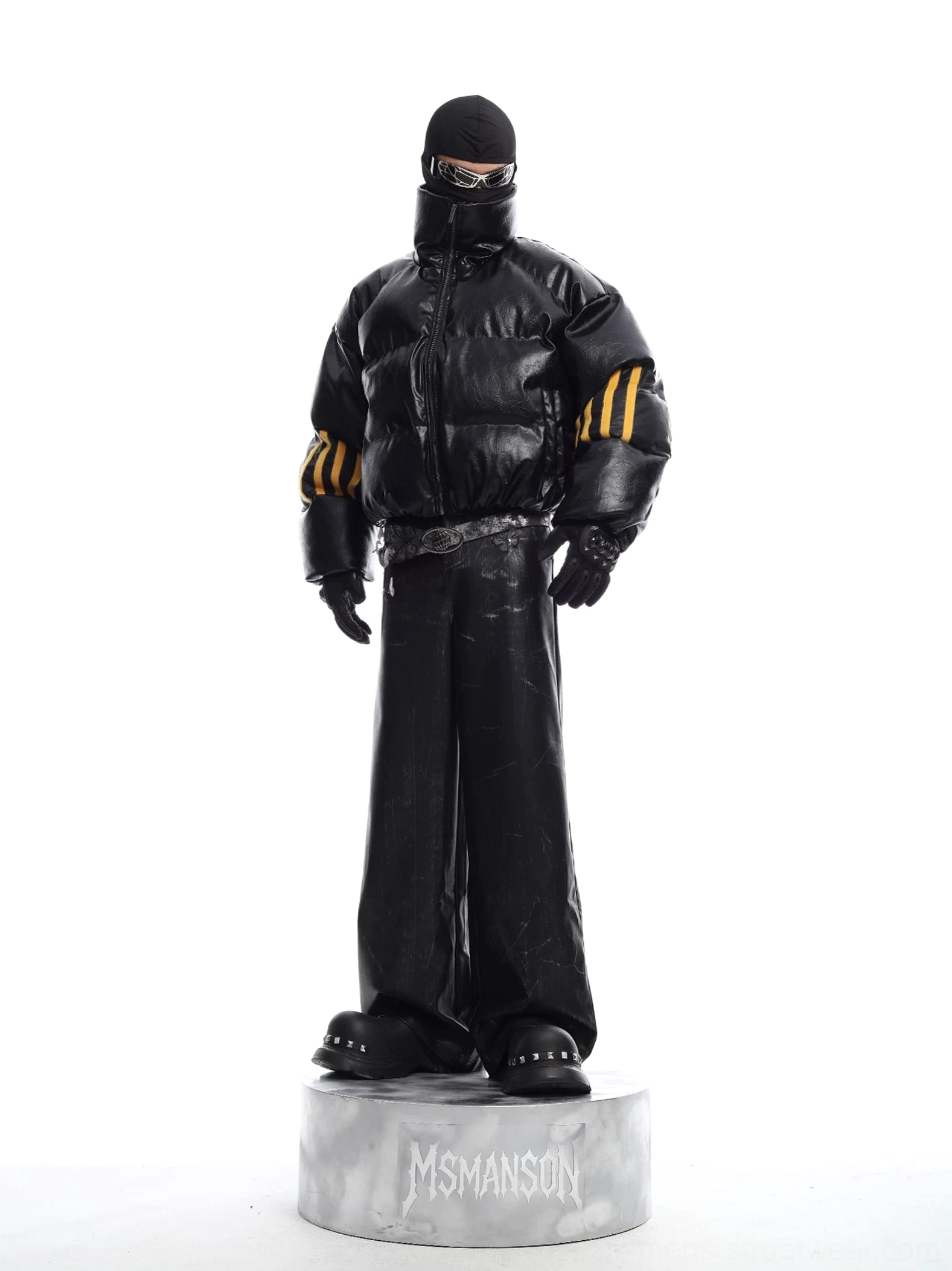 Full front view of black PU leather cropped puffer jacket styled with a complete tactical urban streetwear outfit and bold yellow sleeve details