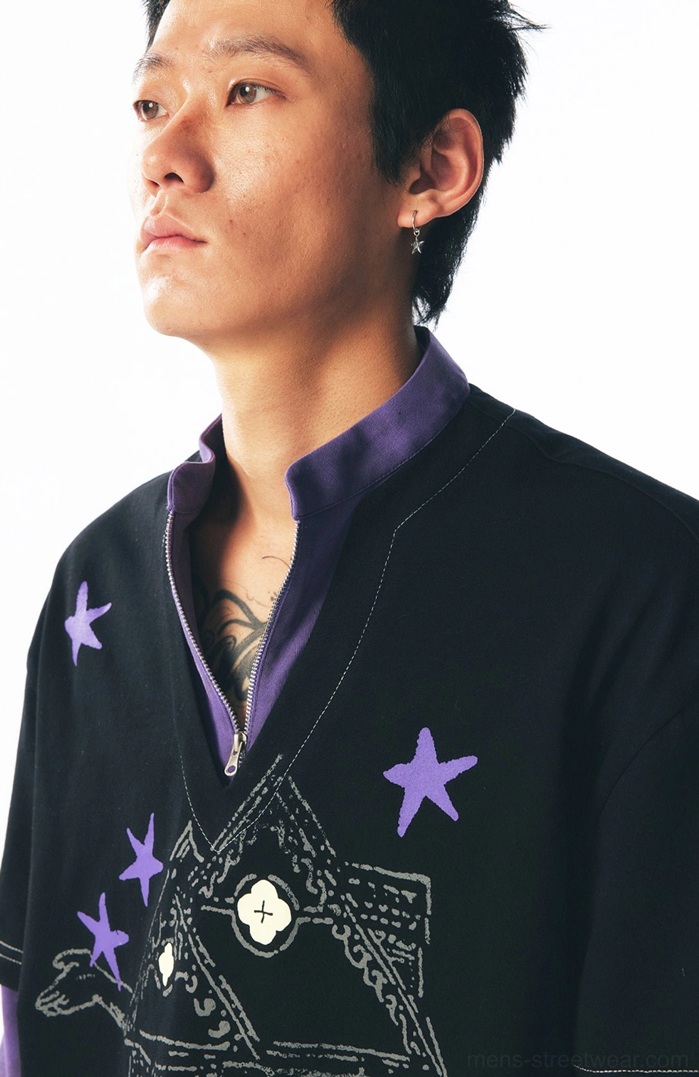 Black and purple two-in-one long sleeve graphic tee with oversized outer layer and contrasting half-zip inner sleeve design