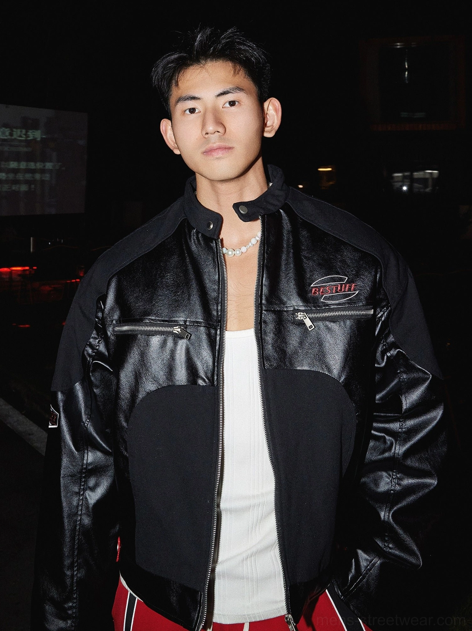 Black racing-inspired winter zip-up streetwear jacket with contrast glossy panels stand collar and chest zipper pockets