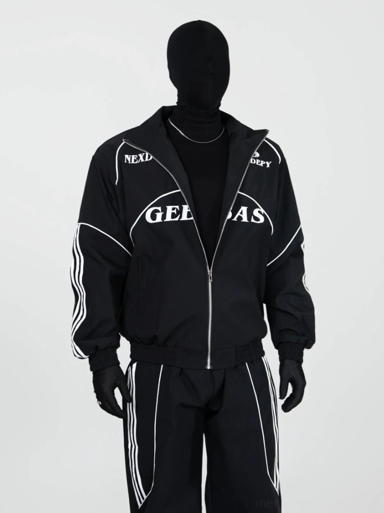 Close-up front view of black racing track jacket with stand collar zipper white sleeve stripes and graphic chest print