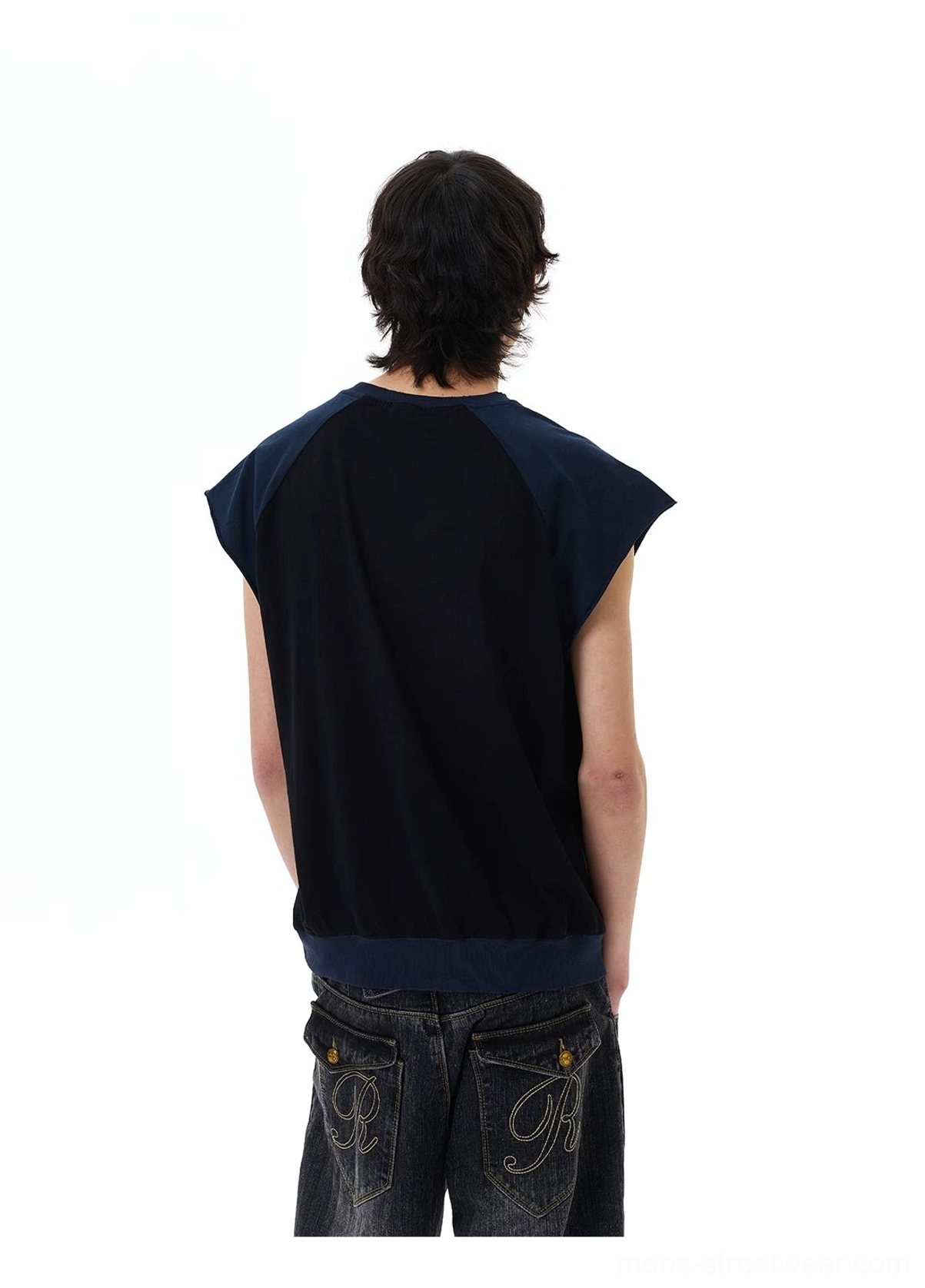 Back view of black raglan cap-sleeve Korean streetwear tee styled with dark wash jeans