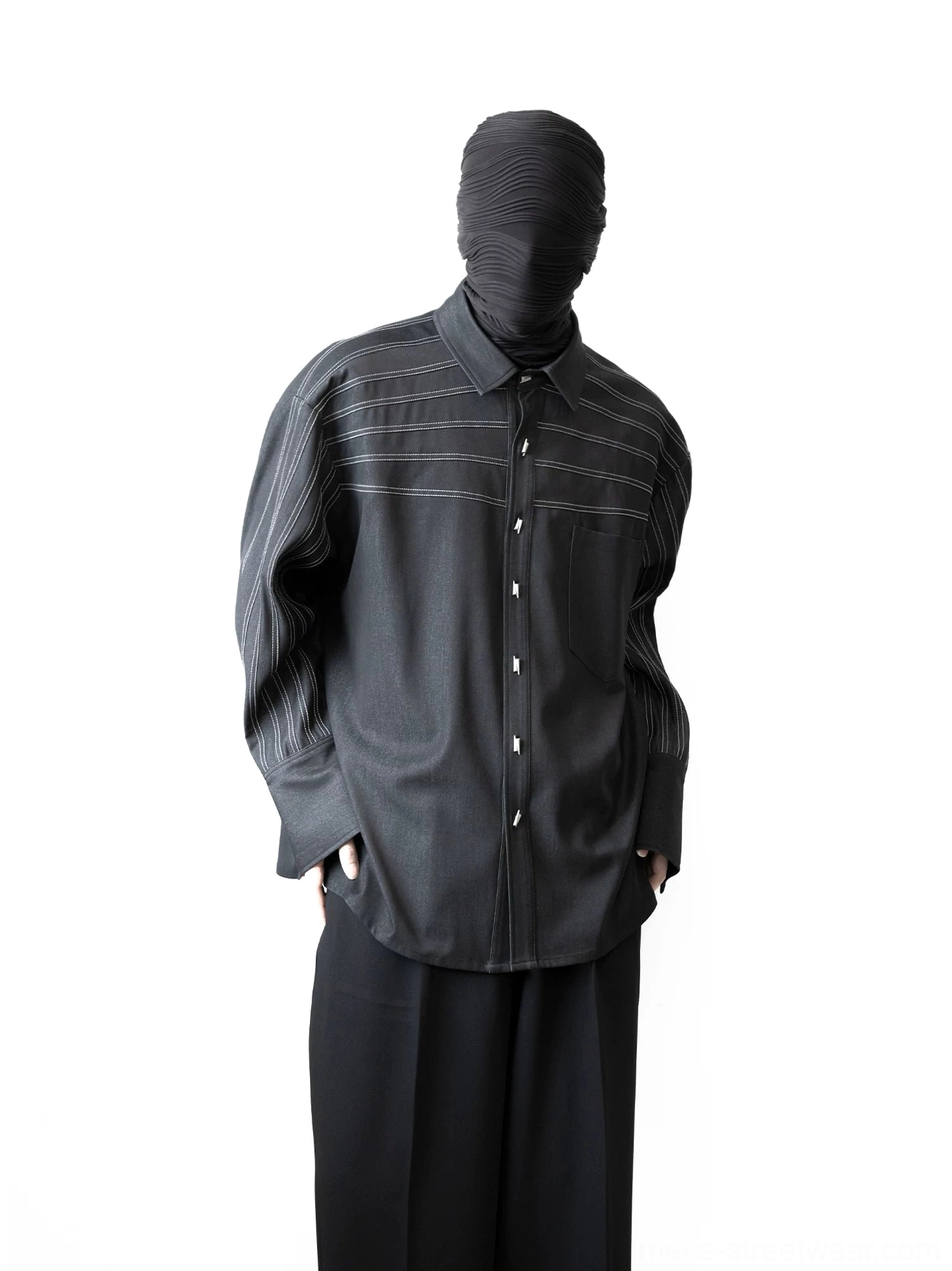 Full outfit view of oversized black stripe stitch shirt styled with wide-leg trousers for a modern Seoul streetwear look