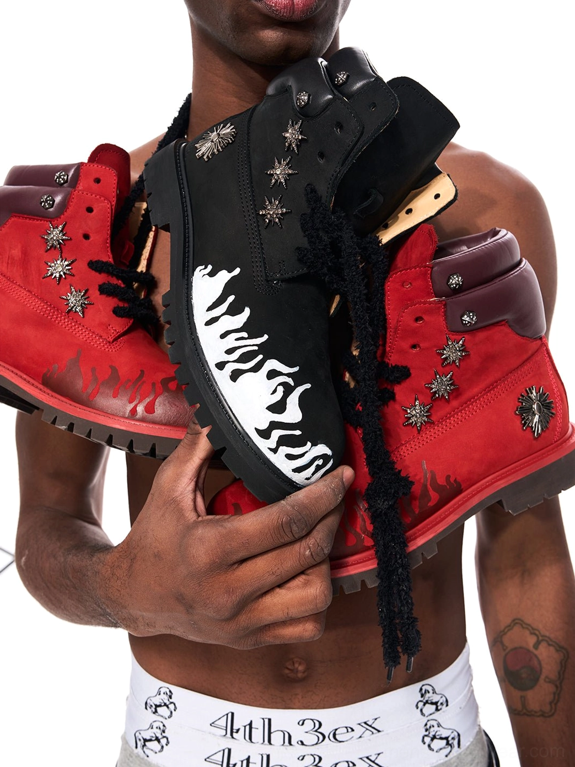 Black and red flame appliqué genuine leather combat boots with contrasting toe flames and lug soles
