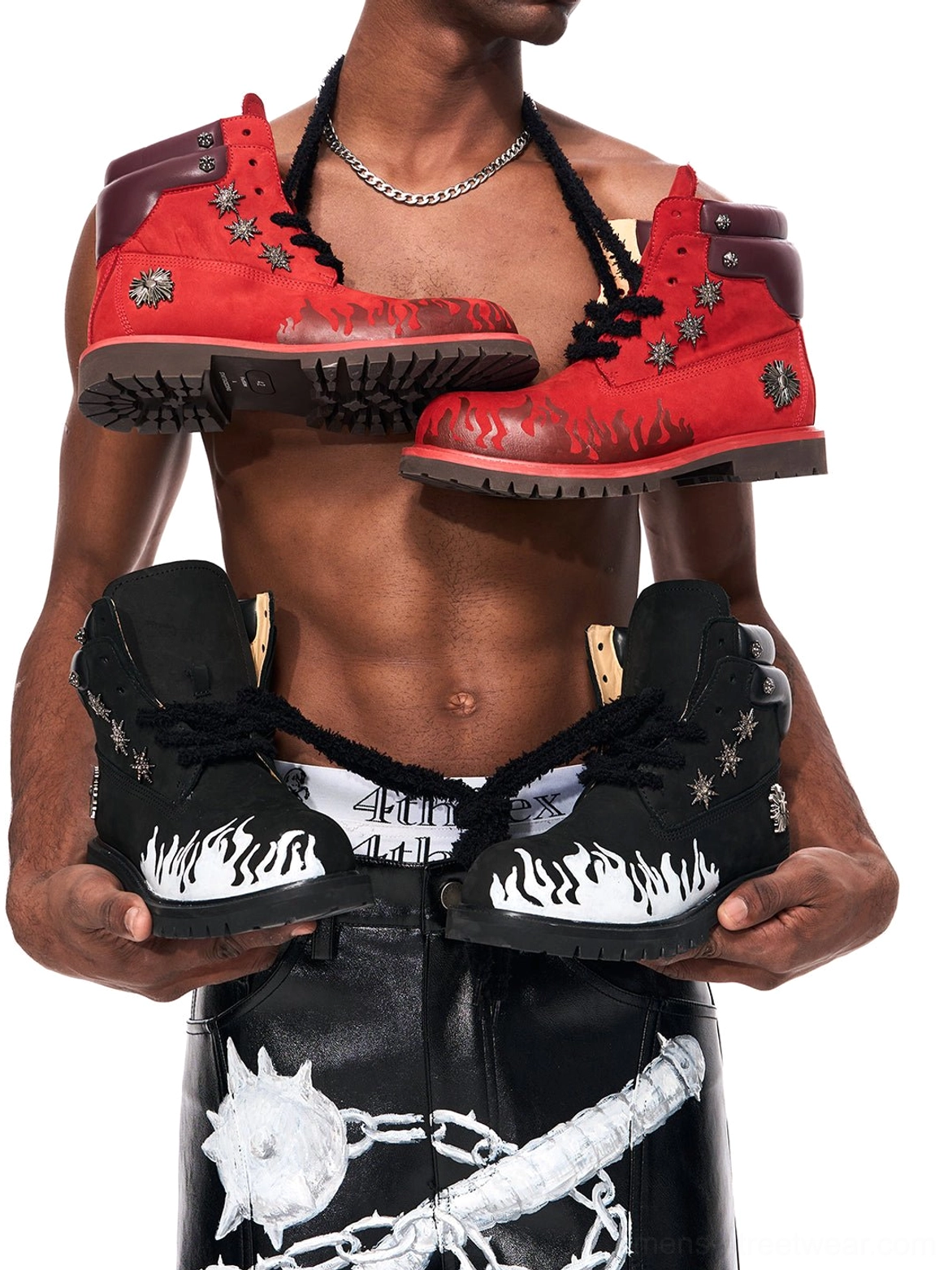 Black and red studded flame appliqué combat boots presented in bold alternative streetwear styling