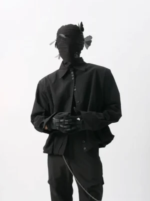 Black relaxed cropped poplin button-up shirt with dropped shoulders and black trousers in a dark Korean streetwear look