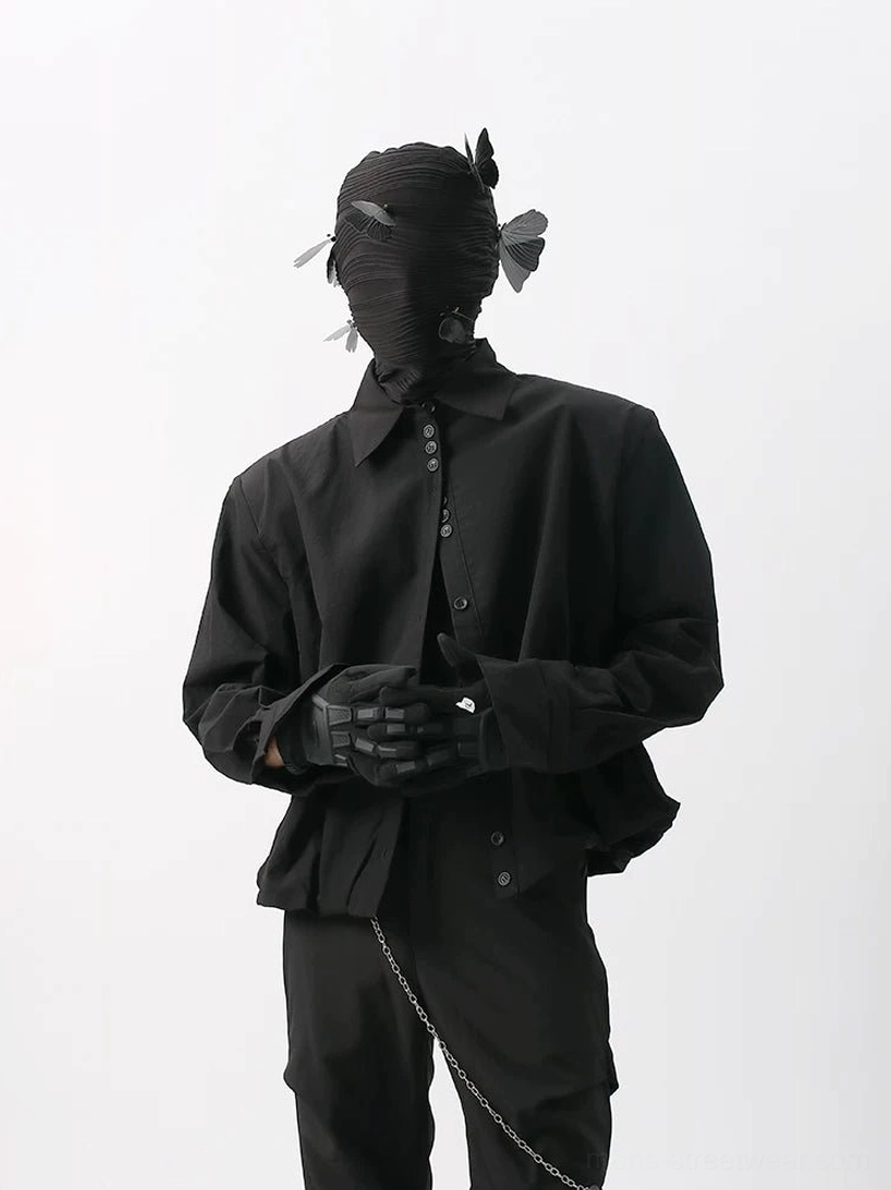 Black relaxed cropped poplin button-up shirt with dropped shoulders and black trousers in a dark Korean streetwear look