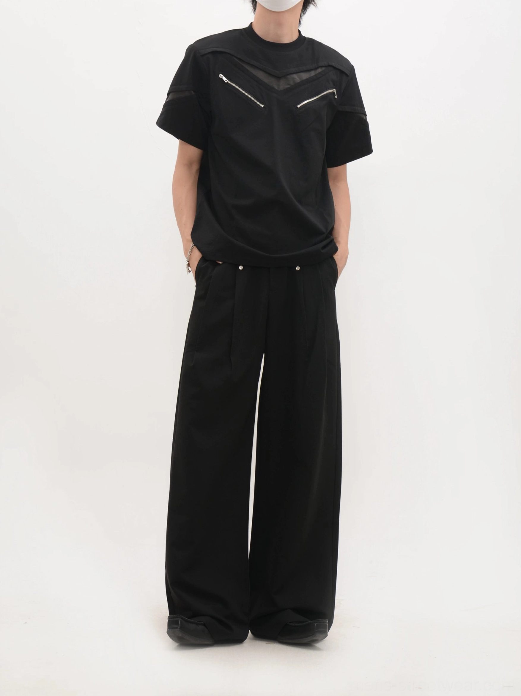 Black relaxed-fit techwear zip panel T-shirt back view with clean streetwear silhouette and wide-leg pants