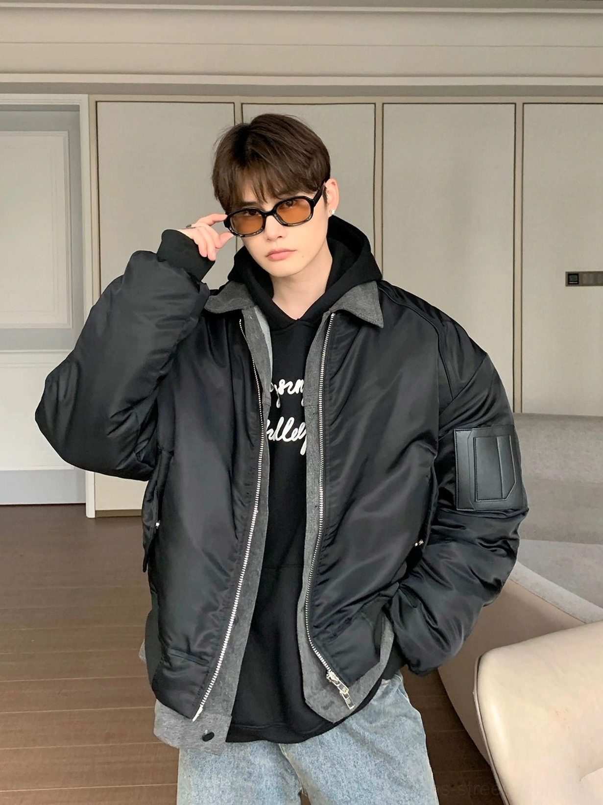 Black relaxed fit zip-front bomber jacket with smooth satin-look finish contrast ribbed trim and left arm utility pocket