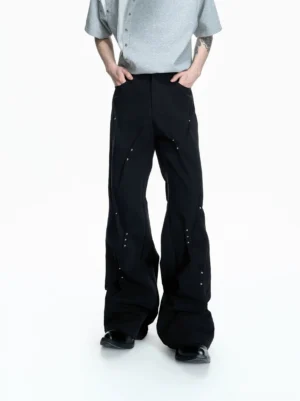 Black rivet sculpt flare denim pants front view with curved panel seams and relaxed wide flared silhouette