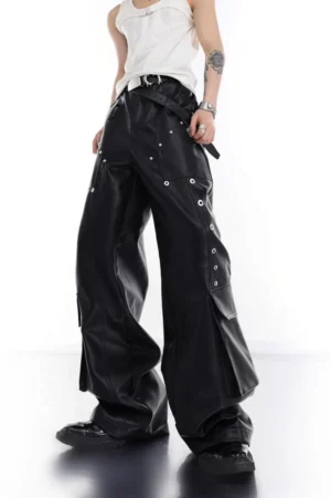 Black riveted PU leather wide-leg cargo pants front view styled with white tank top and chunky black shoes